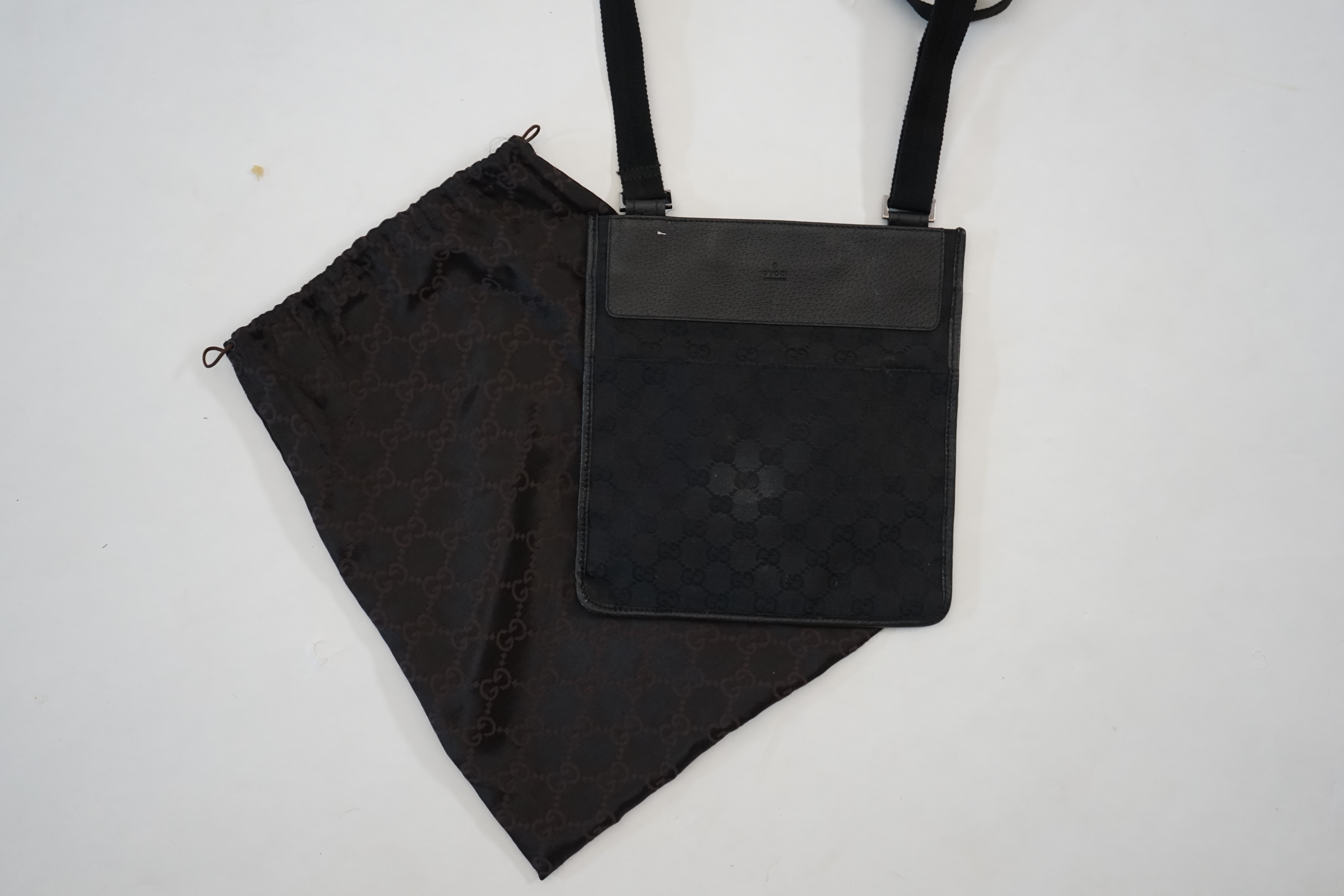 A Gucci black GG canvas crossbody bag Approx width 25cm, depth 1cm, length 24cm, shoulder drop 47cm